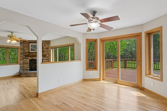 17575 Xenia St NW, Andover, MN 55304 - unfurnished room with plenty of natural light, a ceiling fan, and baseboards