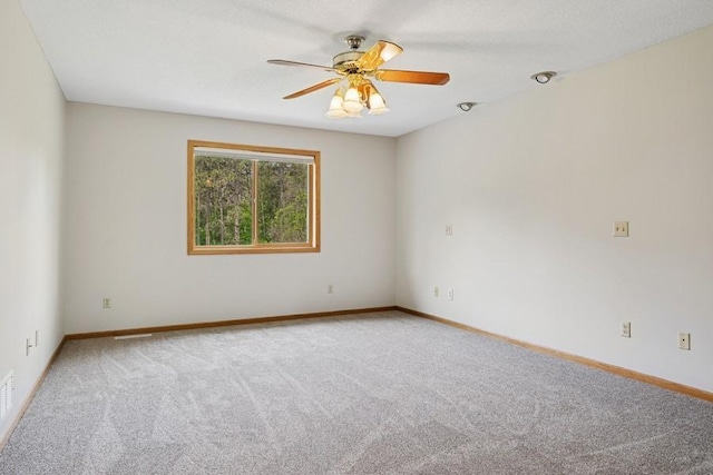 17575 Xenia St NW, Andover, MN 55304 - empty room with carpet floors, ceiling fan, and baseboards