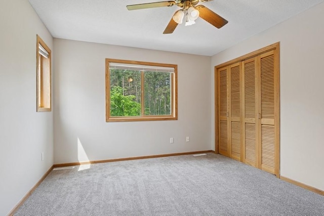 17575 Xenia St NW, Andover, MN 55304 - unfurnished bedroom with multiple windows, carpet floors, baseboards, and a closet