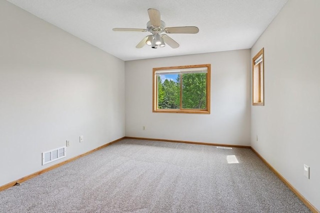 17575 Xenia St NW, Andover, MN 55304 - unfurnished room with carpet floors, ceiling fan, and baseboards