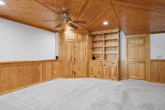 17575 Xenia St NW, Andover, MN 55304 - unfurnished room with wood ceiling, wooden walls, wainscoting, ceiling fan, and light colored carpet