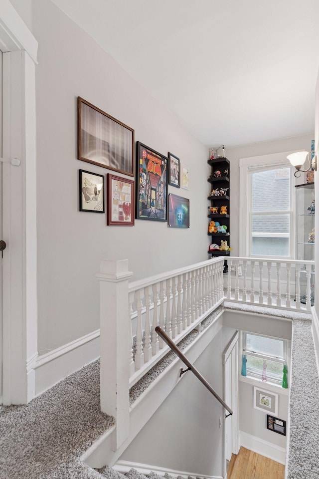 1219 6th St NE, Minneapolis, MN 55413 - stairway featuring plenty of natural light, a chandelier, and wood finished floors