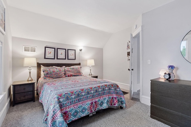 1219 6th St NE, Minneapolis, MN 55413 - carpeted bedroom featuring lofted ceiling and baseboards