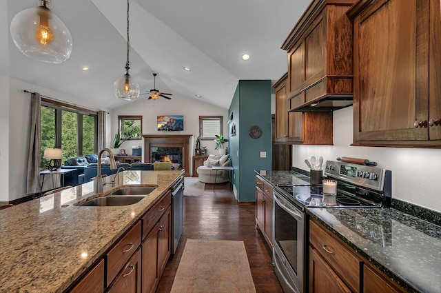 944 Cove Ct NW, Sauk Rapids, MN 56379 - kitchen with appliances with stainless steel finishes, a sink, dark wood-type flooring, vaulted ceiling, and a fireplace