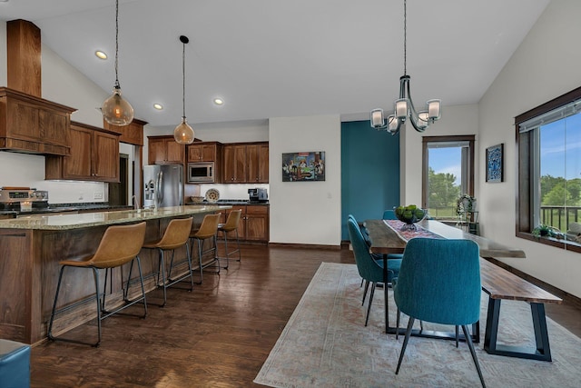 944 Cove Ct NW, Sauk Rapids, MN 56379 - dining room featuring dark wood-type flooring, a chandelier, baseboards, vaulted ceiling, and recessed lighting