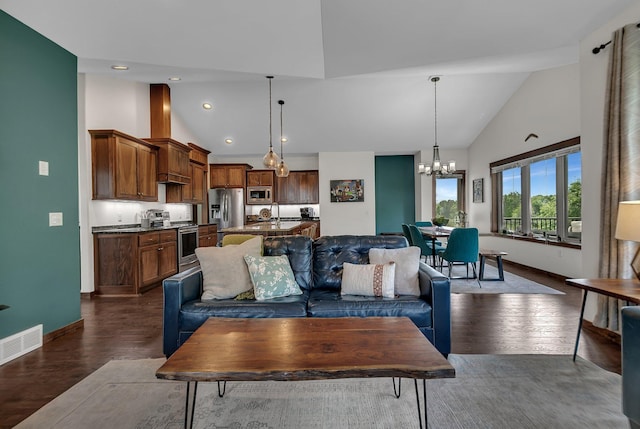 944 Cove Ct NW, Sauk Rapids, MN 56379 - living room with high vaulted ceiling, baseboards, a chandelier, dark wood finished floors, and recessed lighting