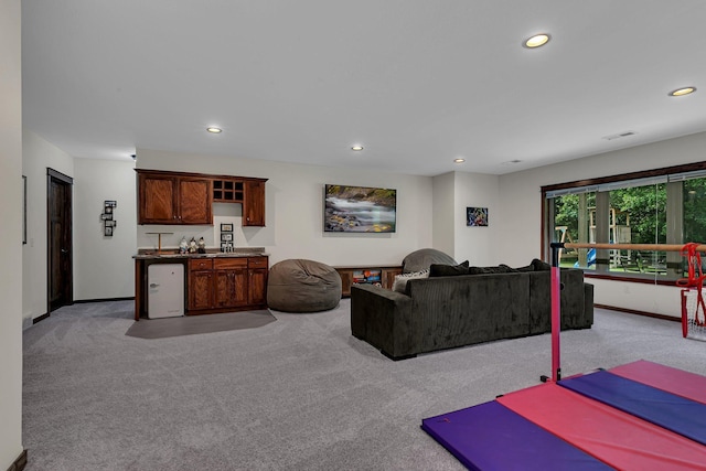944 Cove Ct NW, Sauk Rapids, MN 56379 - living area with wet bar, light carpet, recessed lighting, and baseboards