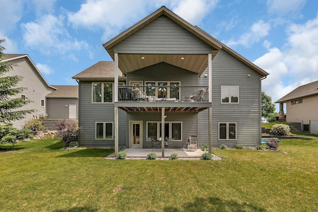 944 Cove Ct NW, Sauk Rapids, MN 56379 - back of property featuring a yard, a balcony, and a patio area