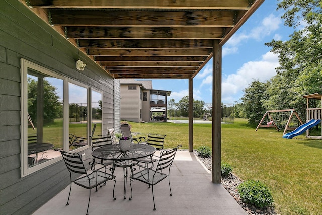 944 Cove Ct NW, Sauk Rapids, MN 56379 - view of patio with a playground and outdoor dining area