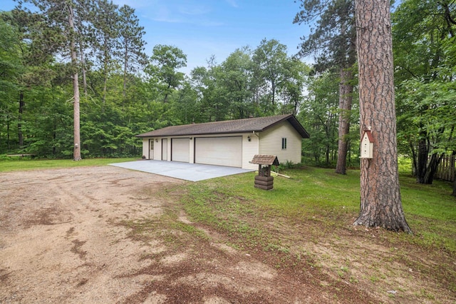 32157 County Road 39, Breezy Point, MN 56472 - view of front of house with a garage, a front lawn, an outdoor structure, and driveway