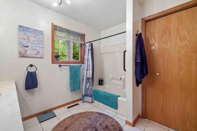 32157 County Road 39, Breezy Point, MN 56472 - full bath featuring shower / bath combo with shower curtain, tile patterned floors, and a textured ceiling