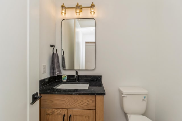 19908 67th Ave, Corcoran, MN 55340 - half bathroom featuring vanity and toilet