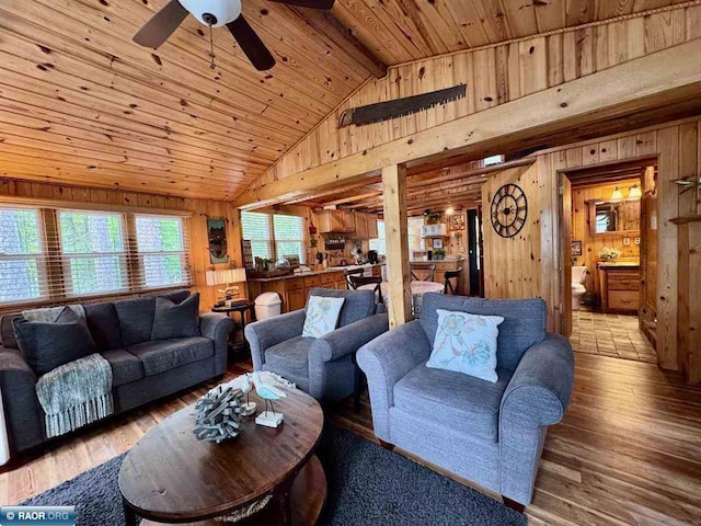 3069 Black Bay Rd, Cook, MN 55723 - living room featuring wood ceiling, wood walls, a ceiling fan, and wood finished floors
