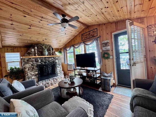3069 Black Bay Rd, Cook, MN 55723 - living area with wooden ceiling, wooden walls, light wood-style flooring, a ceiling fan, and lofted ceiling