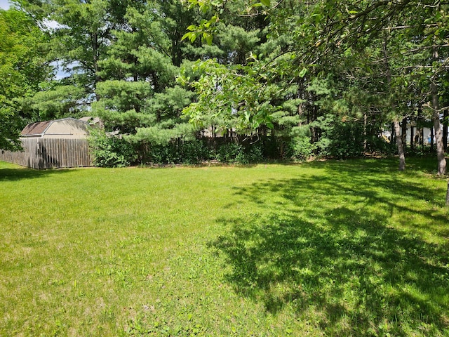 N7018/N7020 564th St, Red Cedar Twp, WI 54751 - view of grassy yard with an outdoor structure