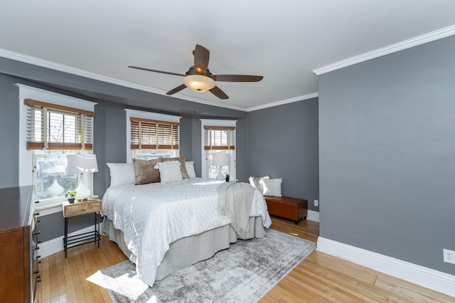 523 6th St SW, Rochester, MN 55902 - bedroom featuring ornamental molding, light wood-type flooring, baseboards, and ceiling fan