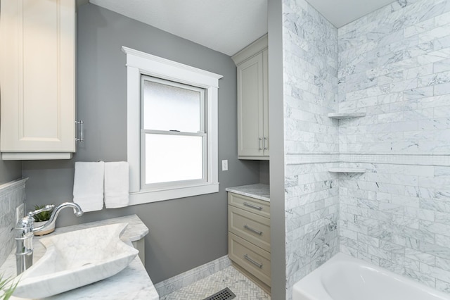 523 6th St SW, Rochester, MN 55902 - full bath featuring vanity, shower / bath combination, tile patterned flooring, and baseboards