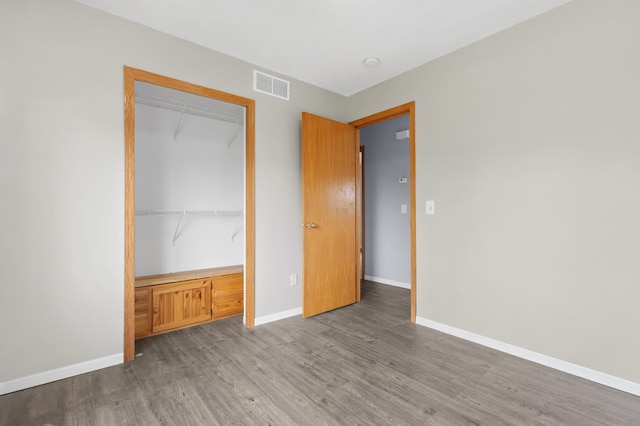 2909 Molina St, Shakopee, MN 55379 - unfurnished bedroom with wood finished floors and a closet