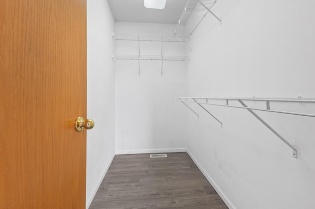 2909 Molina St, Shakopee, MN 55379 - walk in closet featuring dark wood finished floors