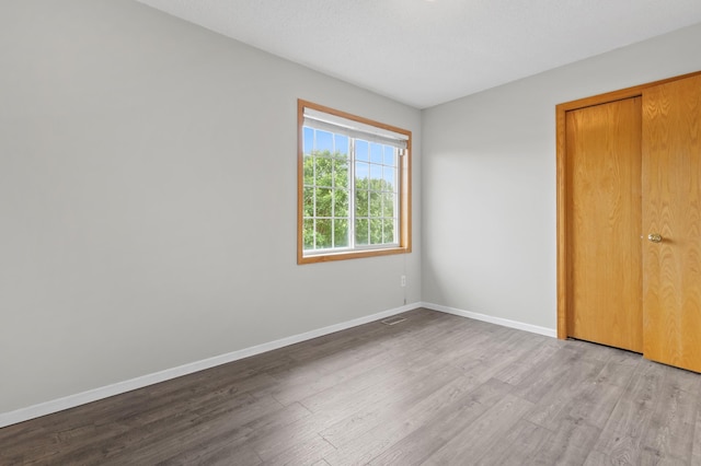 2909 Molina St, Shakopee, MN 55379 - unfurnished bedroom with wood finished floors