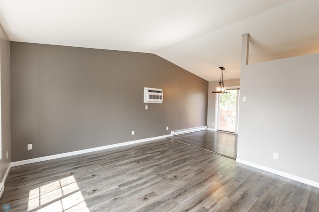 715 49th St S, Fargo, ND 58103 - spare room with a baseboard radiator, a chandelier, lofted ceiling, wood finished floors, and baseboards