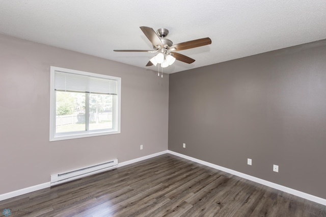 715 49th St S, Fargo, ND 58103 - spare room featuring a baseboard radiator, ceiling fan, dark wood finished floors, and baseboards