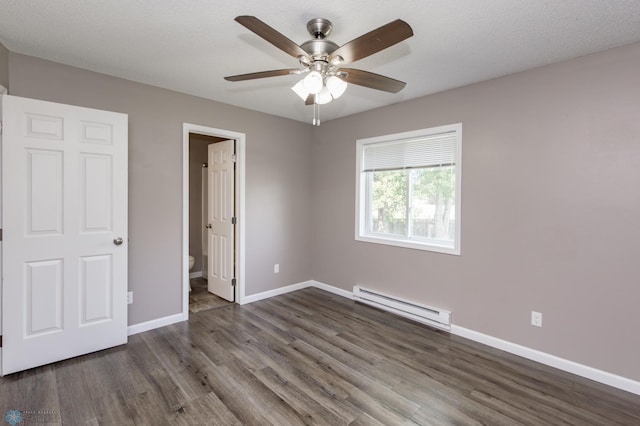 715 49th St S, Fargo, ND 58103 - unfurnished bedroom with a baseboard heating unit, wood finished floors, baseboards, connected bathroom, and ceiling fan
