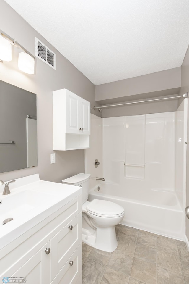 715 49th St S, Fargo, ND 58103 - bathroom featuring vanity, toilet, and shower / washtub combination