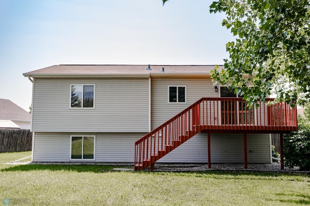 715 49th St S, Fargo, ND 58103 - back of property featuring a deck, a lawn, and stairs
