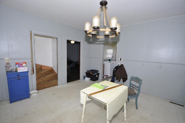 69198 235th St, Dexter, MN 55926 - dining room featuring light floors, a chandelier, stairway, and wainscoting
