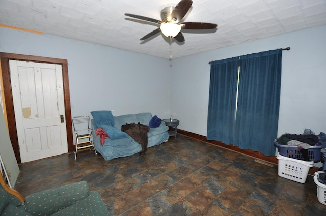 69198 235th St, Dexter, MN 55926 - living area featuring a ceiling fan and stone finish flooring