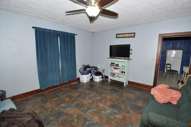 69198 235th St, Dexter, MN 55926 - living area featuring ceiling fan and stone finish flooring