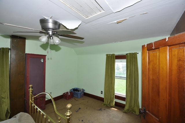 69198 235th St, Dexter, MN 55926 - unfurnished bedroom featuring lofted ceiling, ceiling fan, and carpet flooring