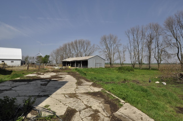 69198 235th St, Dexter, MN 55926 - view of yard with an outdoor structure and a pole building