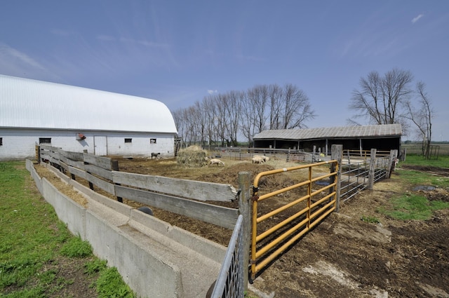 69198 235th St, Dexter, MN 55926 - view of yard with an outbuilding, an exterior structure, and a rural view