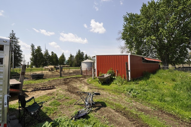 69198 235th St, Dexter, MN 55926 - view of yard featuring a pole building, an outdoor structure, and a view of rural / pastoral area