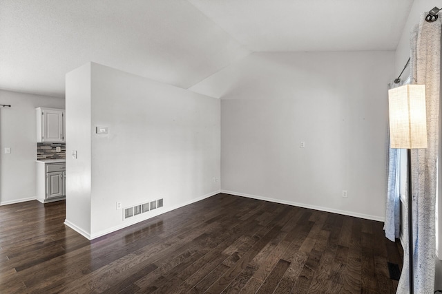 6956 Delarosa Ct, Inver Grove Heights, MN 55076 - empty room with dark wood-style flooring and vaulted ceiling