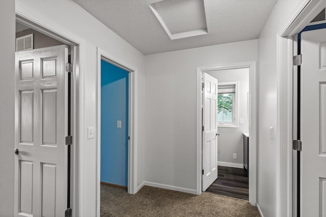 6956 Delarosa Ct, Inver Grove Heights, MN 55076 - hallway with a textured ceiling, carpet floors, and attic access