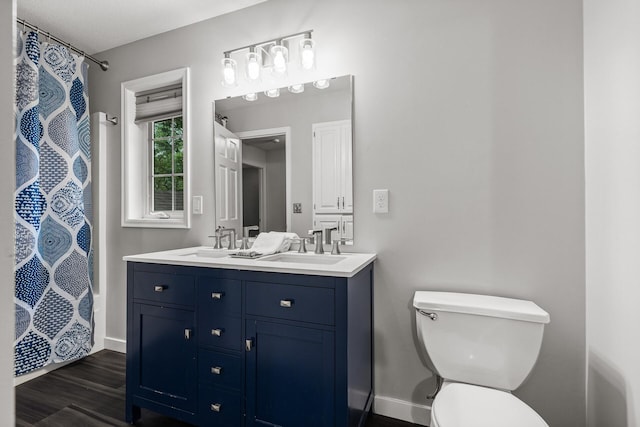6956 Delarosa Ct, Inver Grove Heights, MN 55076 - full bathroom with double vanity, wood finished floors, and a shower with shower curtain