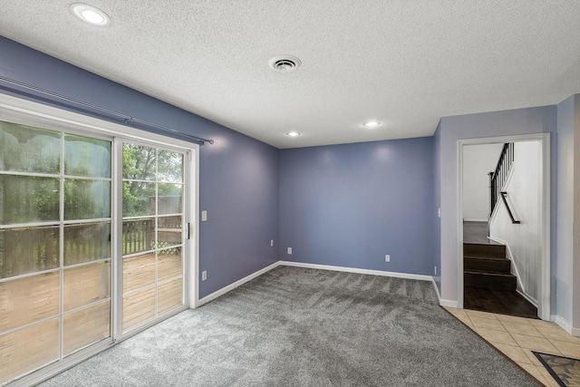 6956 Delarosa Ct, Inver Grove Heights, MN 55076 - empty room with stairway, a textured ceiling, carpet flooring, and recessed lighting