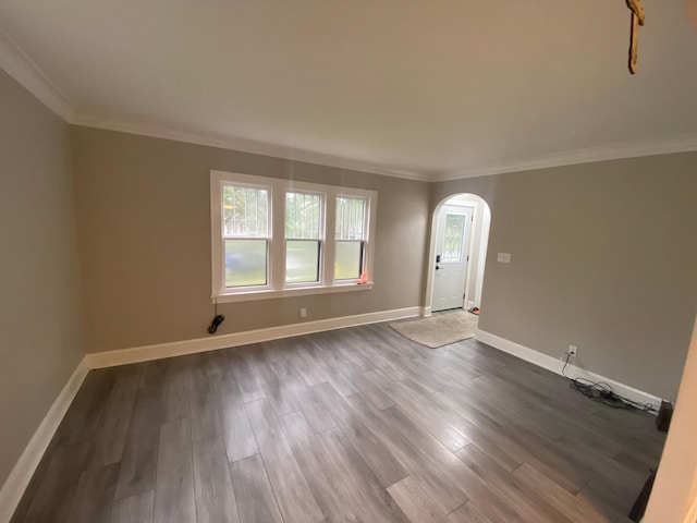1138 6th Ave SE, Rochester, MN 55904 - empty room with arched walkways, ornamental molding, and dark wood finished floors