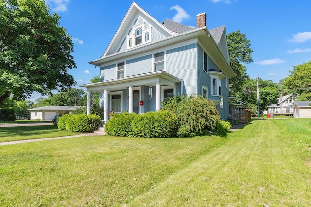 922 Fillmore St, Alexandria, MN 56308 - view of front of property featuring a chimney, a front yard, a porch, and a garage