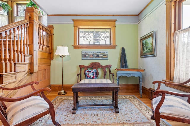 922 Fillmore St, Alexandria, MN 56308 - sitting room with healthy amount of natural light, wood finished floors, and crown molding