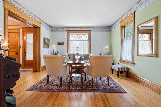 922 Fillmore St, Alexandria, MN 56308 - dining room featuring hardwood / wood-style floors and ornamental molding