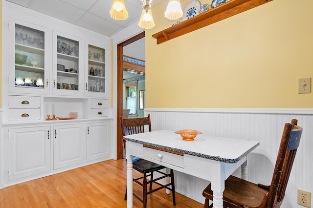 922 Fillmore St, Alexandria, MN 56308 - dining space with wainscoting and light wood finished floors
