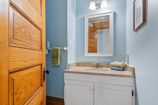 922 Fillmore St, Alexandria, MN 56308 - bathroom featuring vanity and wood finished floors