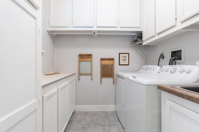922 Fillmore St, Alexandria, MN 56308 - laundry area featuring washer and dryer and cabinet space