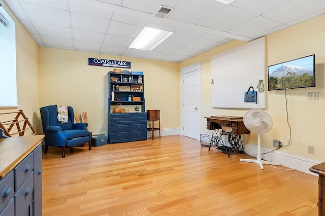 922 Fillmore St, Alexandria, MN 56308 - sitting room with light wood-style flooring and a drop ceiling