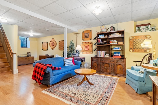 922 Fillmore St, Alexandria, MN 56308 - living area with light wood-type flooring, stairs, and a paneled ceiling