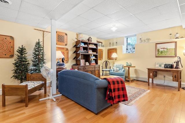 922 Fillmore St, Alexandria, MN 56308 - living room with light wood-type flooring and a baseboard radiator